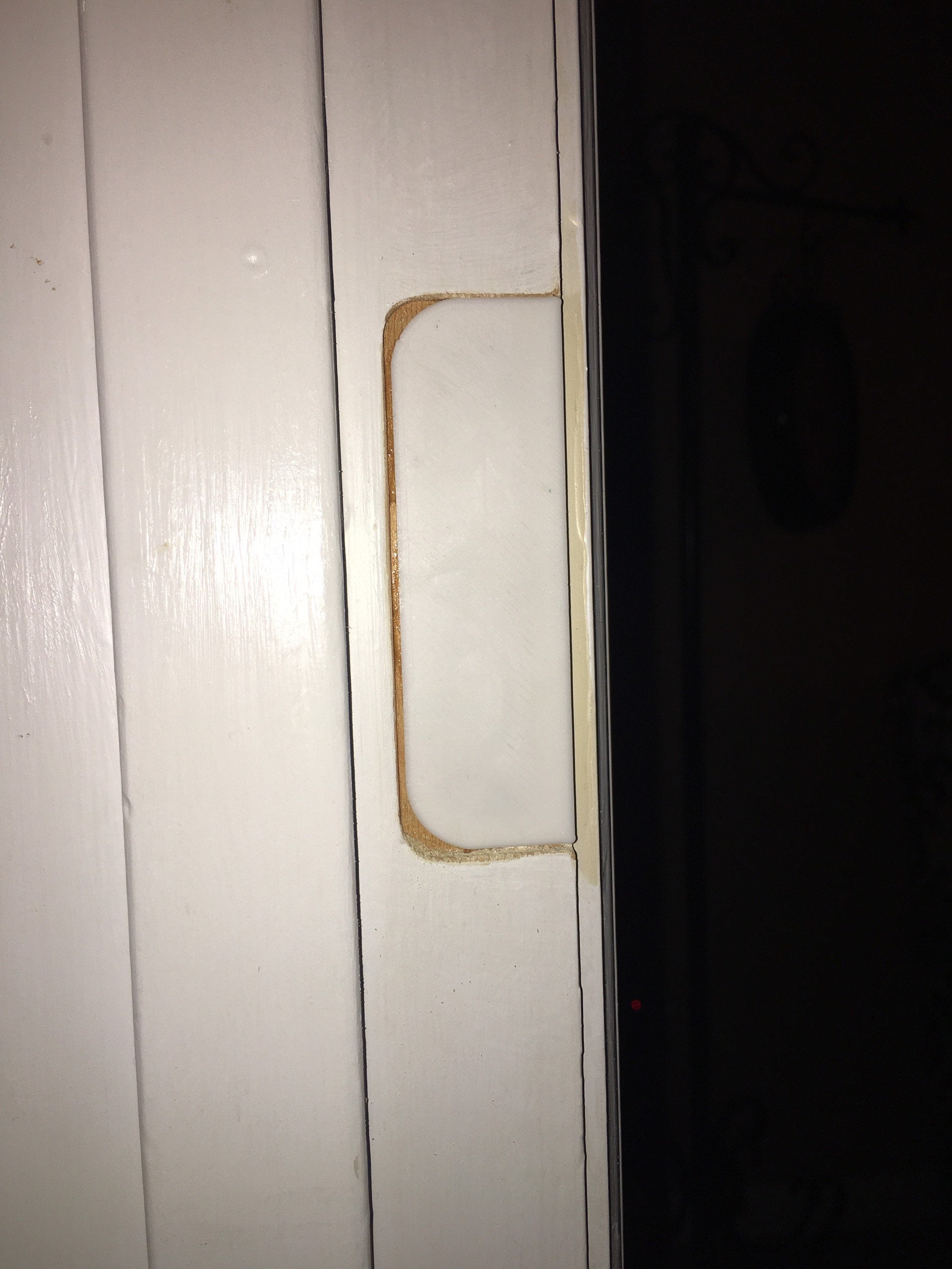 Door hinge filler installed in old hinge mortise on door jamb ready for spackle